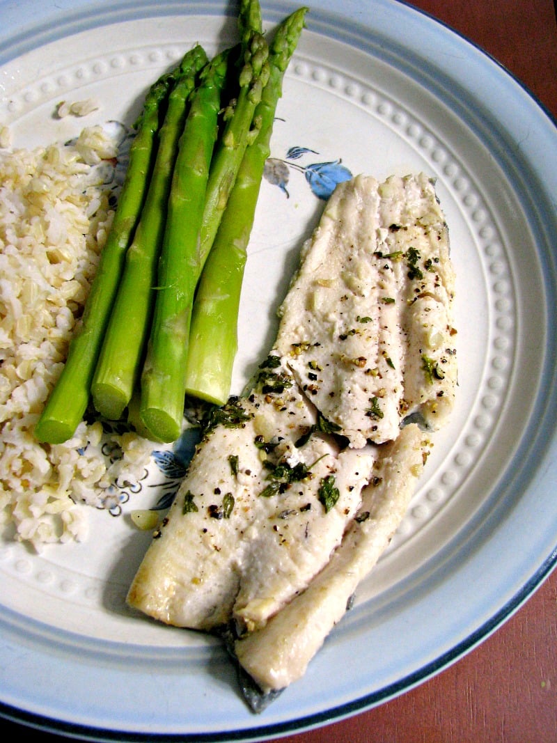 Quick, easy pan seared lemon pepper rainbow trout, with fresh squeezed lemon juice, fresh ground pepper, and garlic makes an easy weeknight dinner.