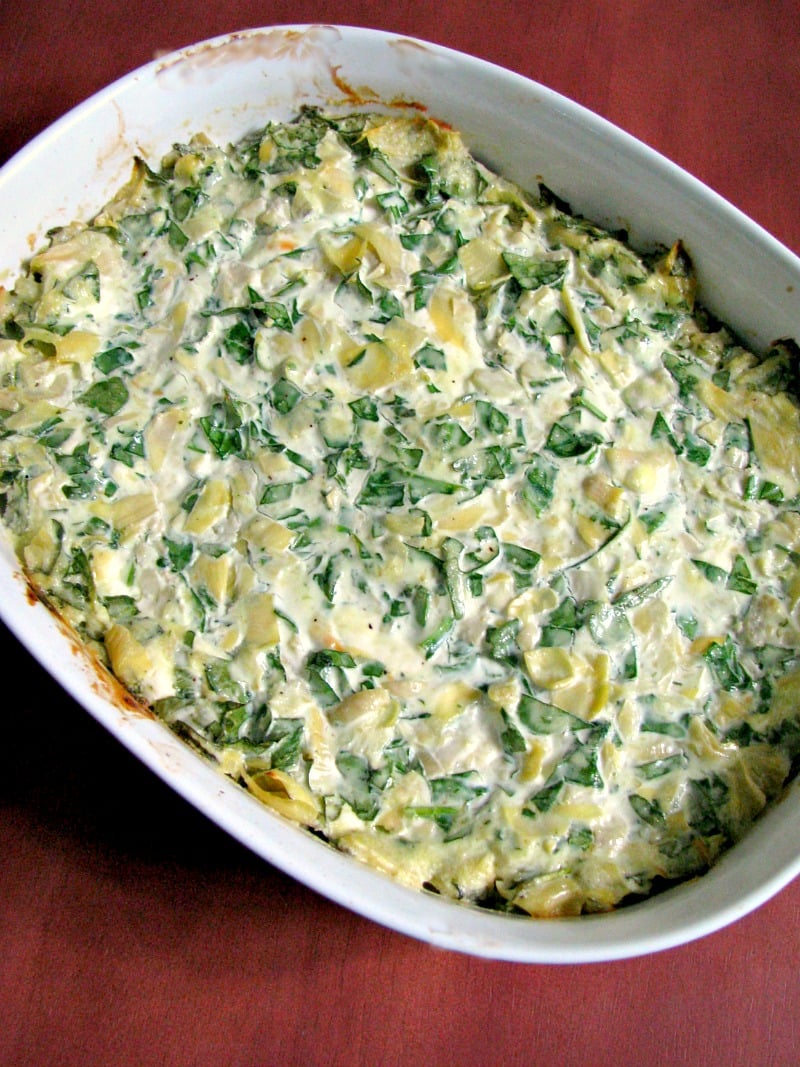 Spinach Artichoke Dip, made with fresh or frozen spinach, canned artichokes, cream cheese, and Gouda cheese, then baked or cooked in the slow cooker. 