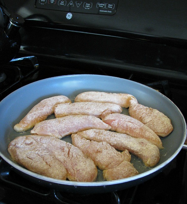 Floured Chicken in Skillet- Skillet Chicken with Spinach and Avocado recipe.