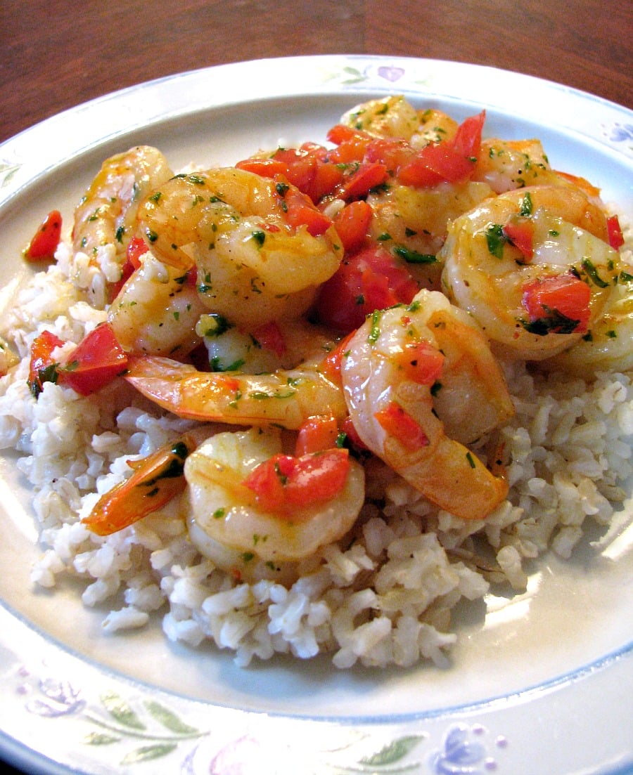 Quick and easy Shrimp and Bell Pepper Skillet with scallions, parsley, and black pepper in a butter sauce served over brown rice.