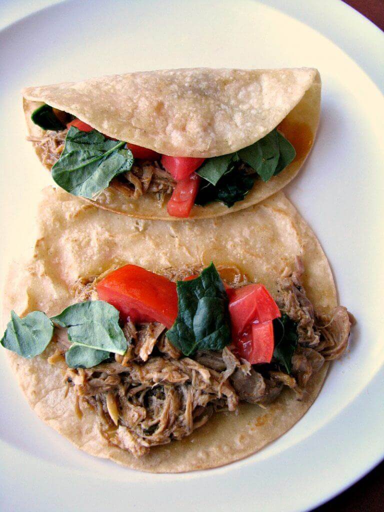 These Slow Cooker Pork Carnitas are bursting with flavor! Pork shoulder simmered with the perfect blend of seasonings, onions, and garlic simmered in orange juice and lime juice, then quickly fried.