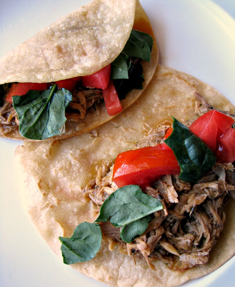 These Slow Cooker Pork Carnitas are bursting with flavor! Pork shoulder simmered with the perfect blend of seasonings, onions, and garlic simmered in orange juice and lime juice, then quickly fried. You won't want to wait for Taco Tuesday for these!
