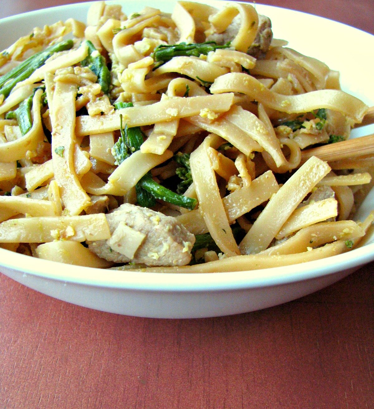 Pad See Ew ( meaning "fried with soy sauce") is made with large rice noodles, pork loin, broccoli, and scrambled eggs fried in soy sauce. Makes a great weeknight dinner and better than takeout! 