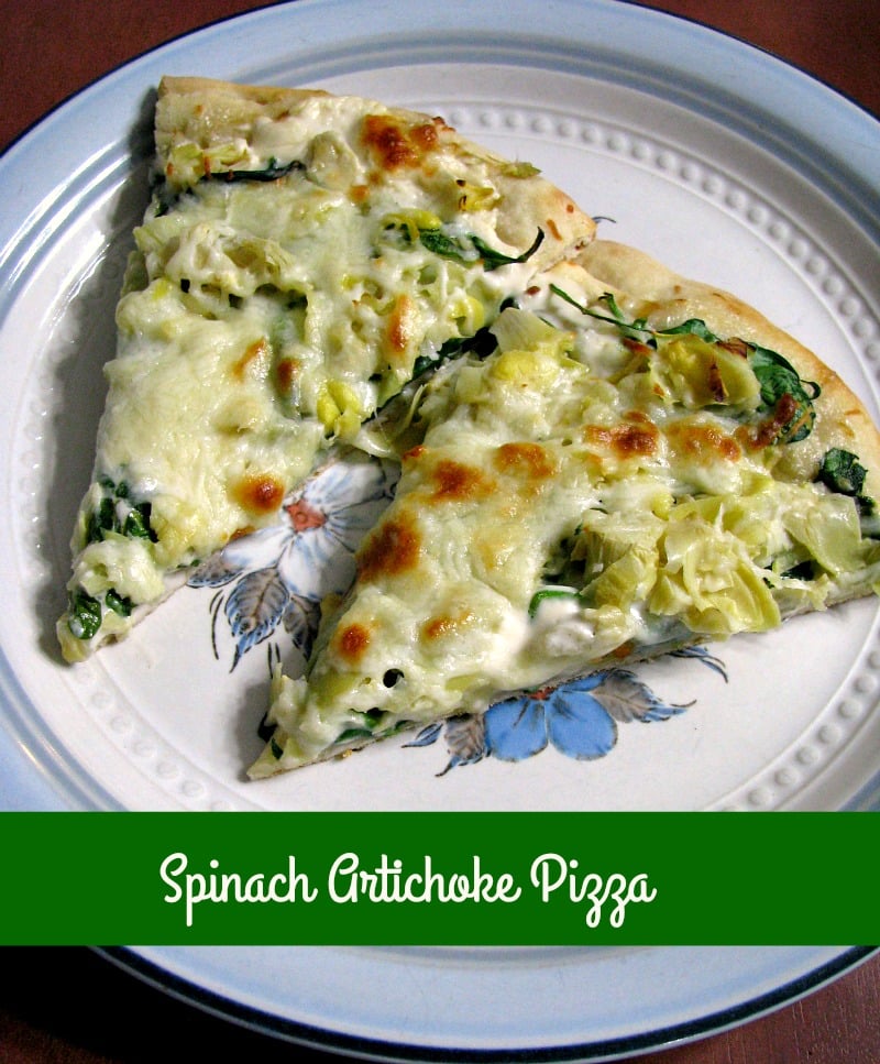 Quick and easy Spinach Artichoke Pizza, made with store-bought pizza dough, canned artichoke hearts, fresh spinach, and Alfredo sauce makes a great meatless meal. 