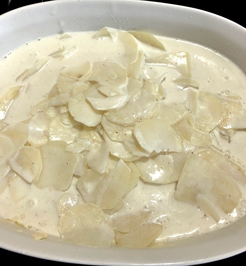 photo of potatoes with cream in a baking dish