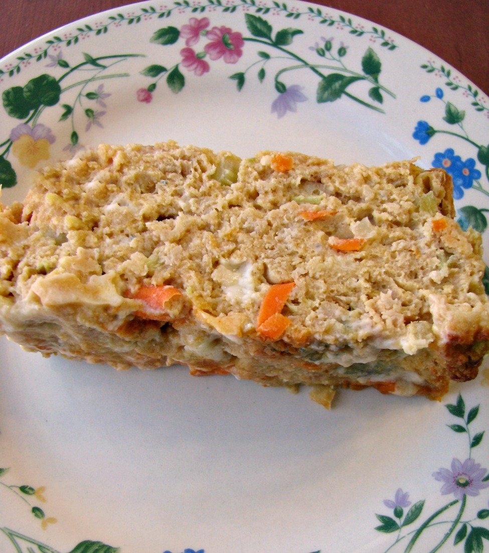 Plated Buffalo Chicken Meatloaf with ground chicken, celery, shredded carrots, blue cheese, and wing sauce.