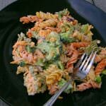 Photo of Broccoli Cheddar Pasta Salad on a black plate