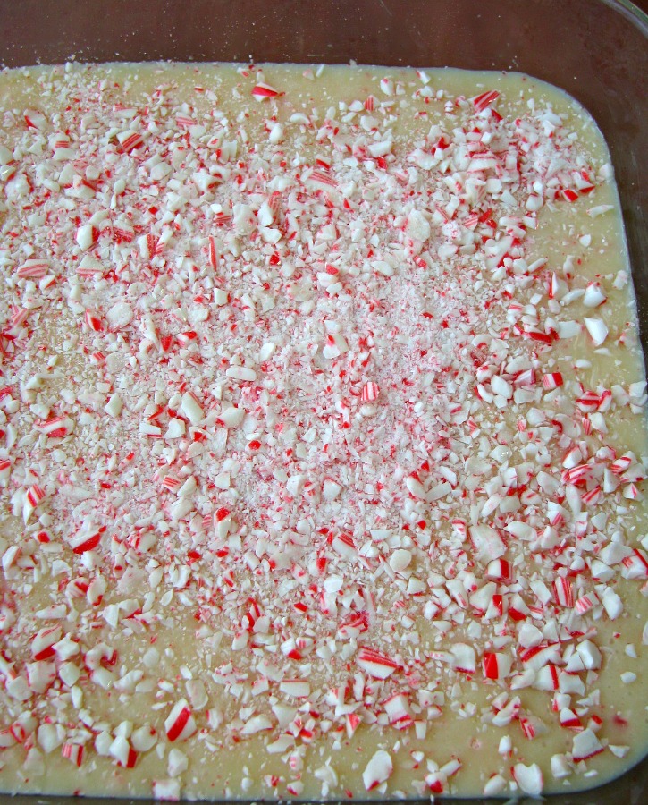 Cooked White Chocolate Candy Cane Fudge is fudge made with white chocolate mixed with crushed candy canes. This the perfect Christmas treat!