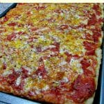 This copycat Victory Pig Sicilian Style Pizza is made with hand crushed tomatoes, onions, and lots of cheese.
