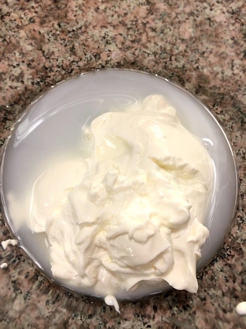 Photo of sour cream and vinegar in a glass bowl