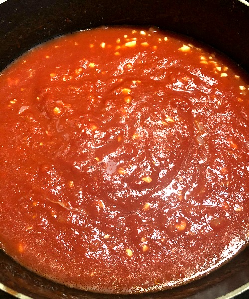 photo of vodka sauce cooking on the stove 
