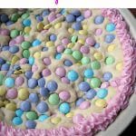 This Easter Sugar Cookie Pie, made with refrigerated cookie dough and pastel colored chocolate candy, is a great, easy, sweet treat.