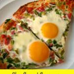 Cheesy Ham Egg and Asparagus Breakfast Pizza made with a homemade pizza crust, diced ham, asparagus, and sunny-side up eggs, is perfect for brunch!