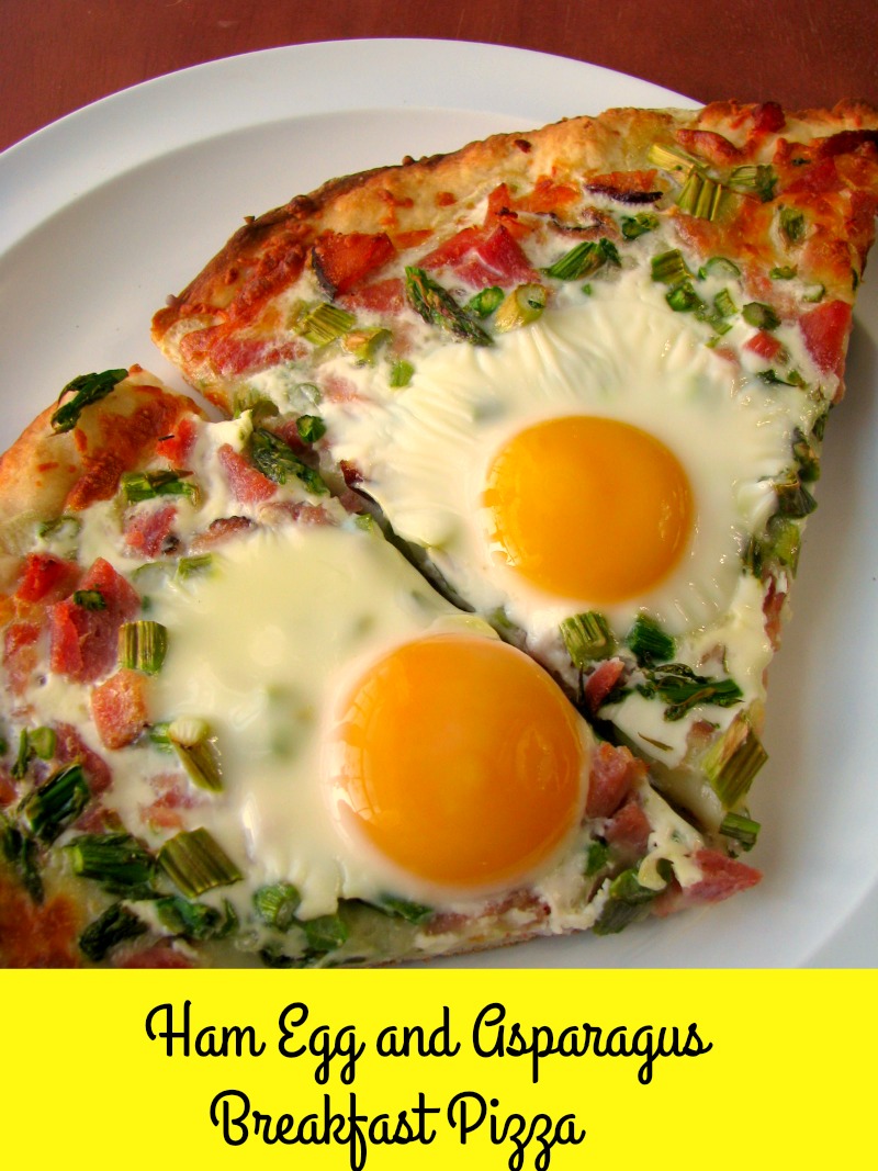  Cheesy Ham Egg and Asparagus Breakfast Pizza made with a homemade pizza crust is perfect for brunch! 