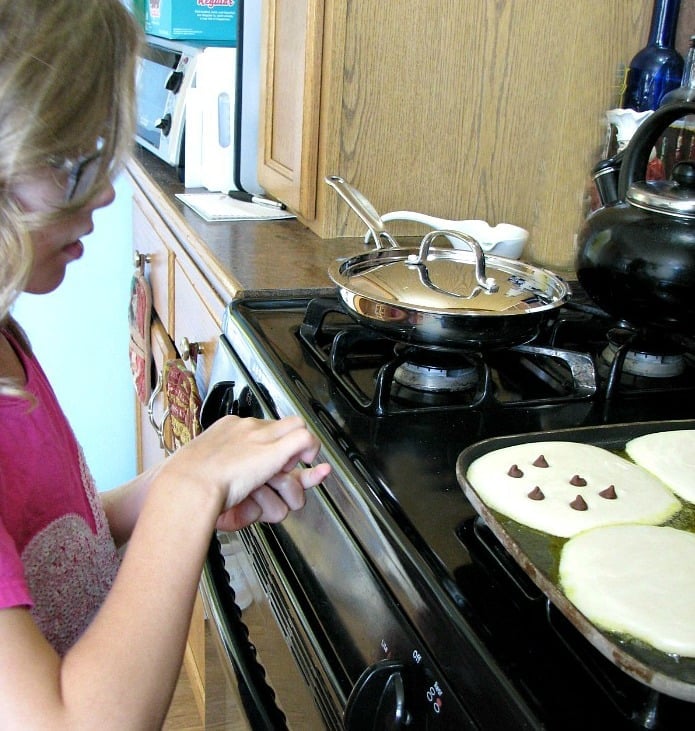 Adding chocolate chips to Nate's Homemade Pancake Batter.