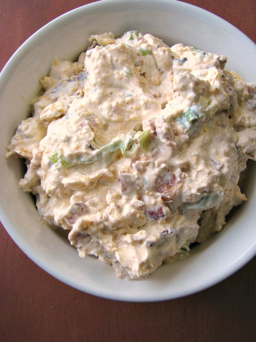 Photo of Crack Dip also known as Bacon Cheddar Ranch Dip in a small white baking bowl