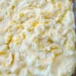 Comfort food at its finest, this American Pierogi Casserole is filled with mashed potatoes, egg noodles, onions, American and cheddar cheese, and lots of butter. It's great for any get together or a warm, cosy dinner.