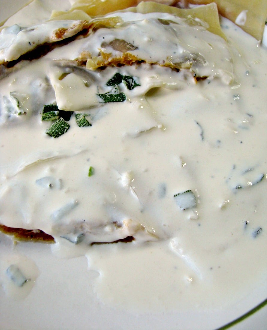 Homemade Pumpkin Ravioli with Parmesan Sage Cream Sauce is a restaurant quality main dish made easy with canned pumpkin puree and wonton wrappers. They taste like pumpkin pie filled pasta! 