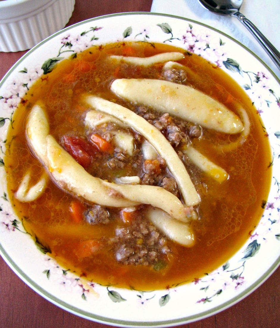 A favorite childhood soup, Noodles and Ground Beef Soup is filled with three noodle shapes, ground beef, finely diced carrots, and green peppers in a flavorful beef broth.