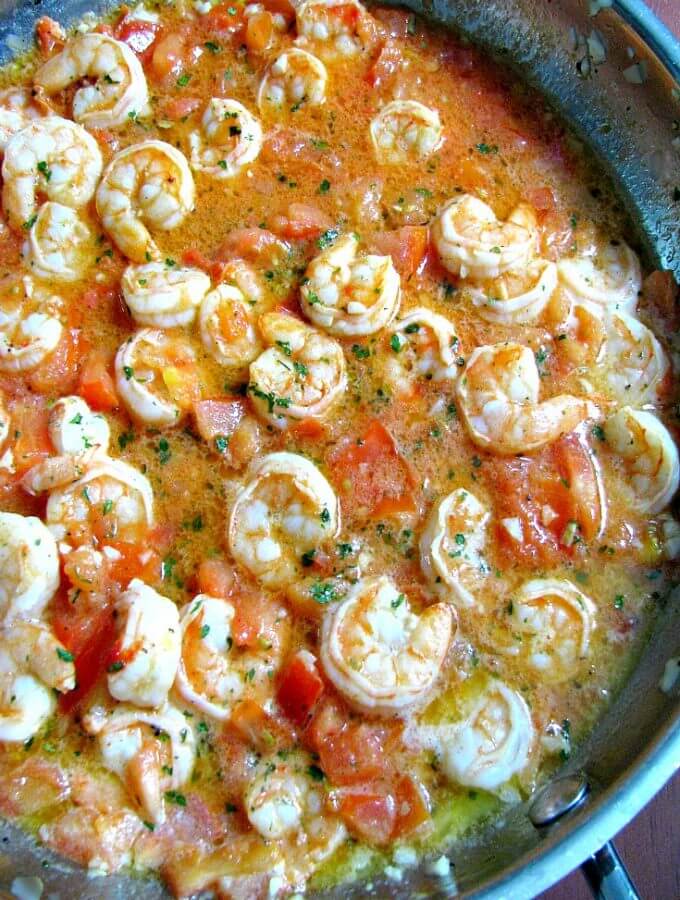 A delicious change from traditional shrimp scampi, Red Shrimp Scampi is made with lots of garlic, tomatoes, parsley, and black pepper in butter sauce. 