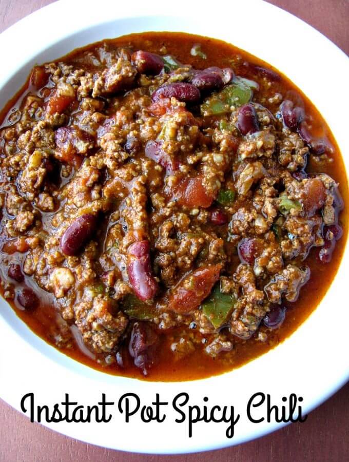 Instant Pot Spicy Chili made with ground beef, kidney beans, jalapenos, and sriracha, is an easy Instant Pot pressure cooker chili recipe perfect for cold Winter days.