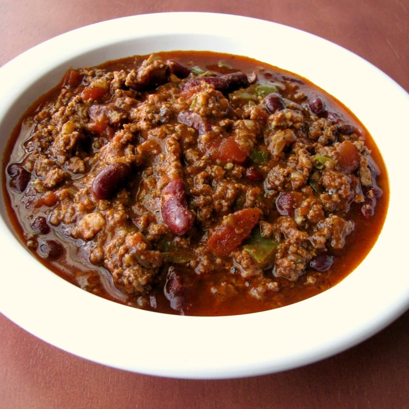 Instant Pot Pressure Cooker Spicy Chili made with ground beef, kidney beans, jalapenos, and sriracha, is an easy Instant Pot pressure cooker chili recipe perfect for cold Winter days.