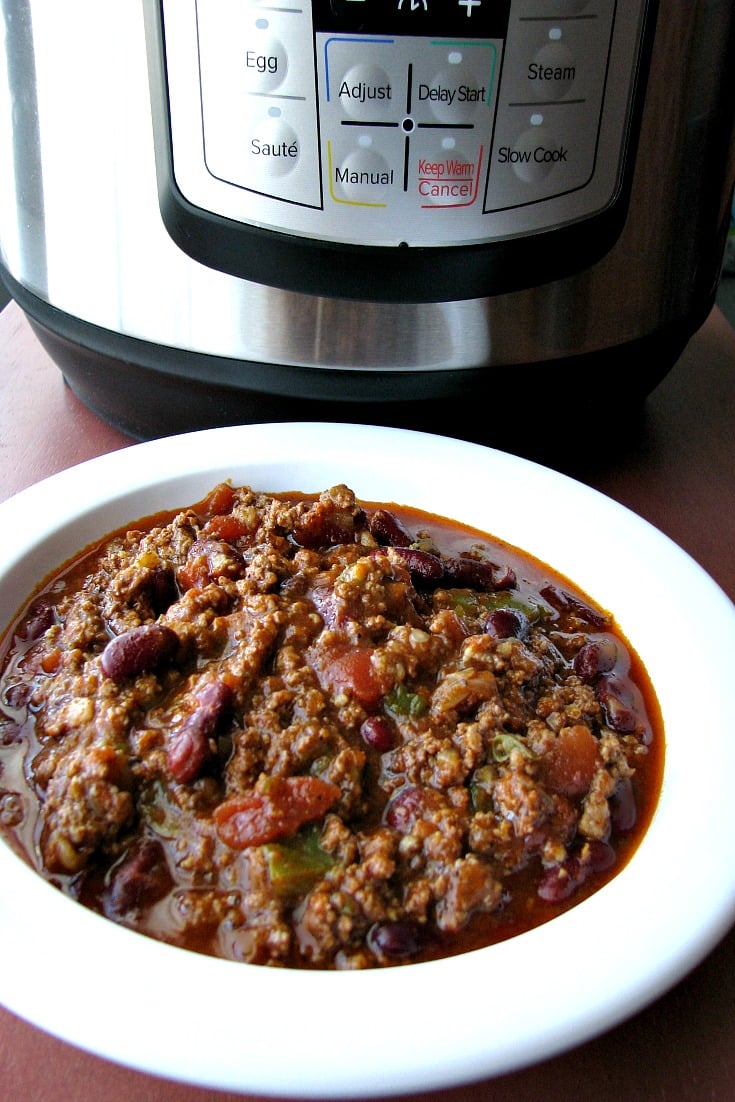 Instant Pot Spicy Chili made with ground beef, kidney beans, jalapenos, and sriracha, is an easy Instant Pot pressure cooker chili recipe perfect for cold Winter days.