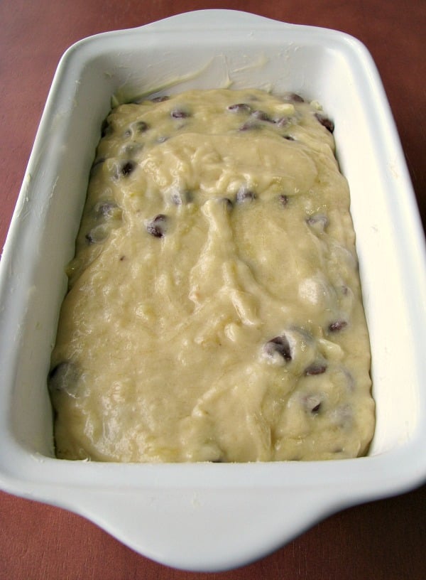 Unbaked chocolate chip banana bread dough in white loaf pan