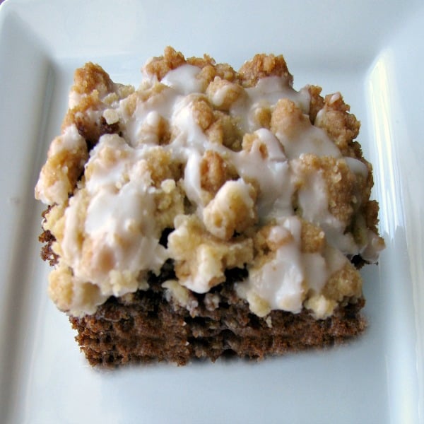 Photo of a slice of espresso coffee cake on a white plate