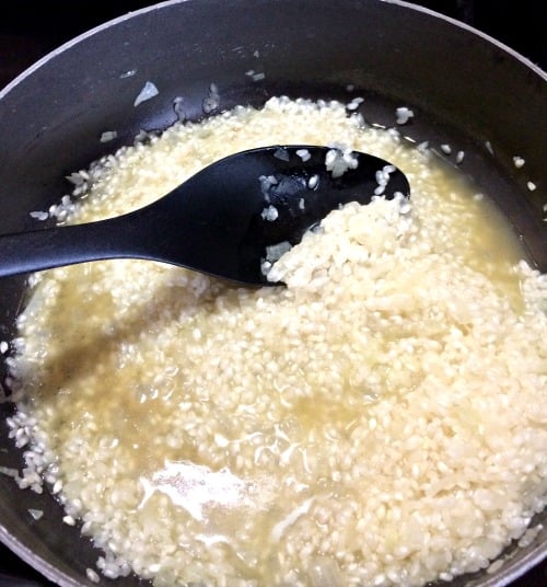 Photo of chicken broth added to rice 