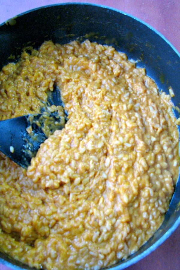 Photo of fully cooked risotto with pumpkin puree cheese and cream stirred in 