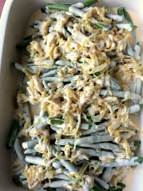 Photo of green bean casserole with cheese sauce added 