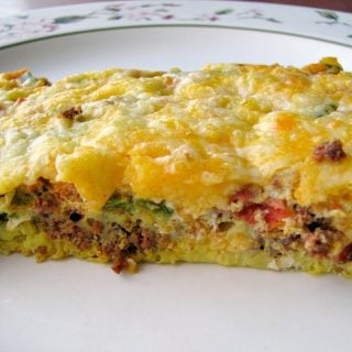 Close up photo of a slice of Mexican Chorizo Breakfast Casserole on a white plate