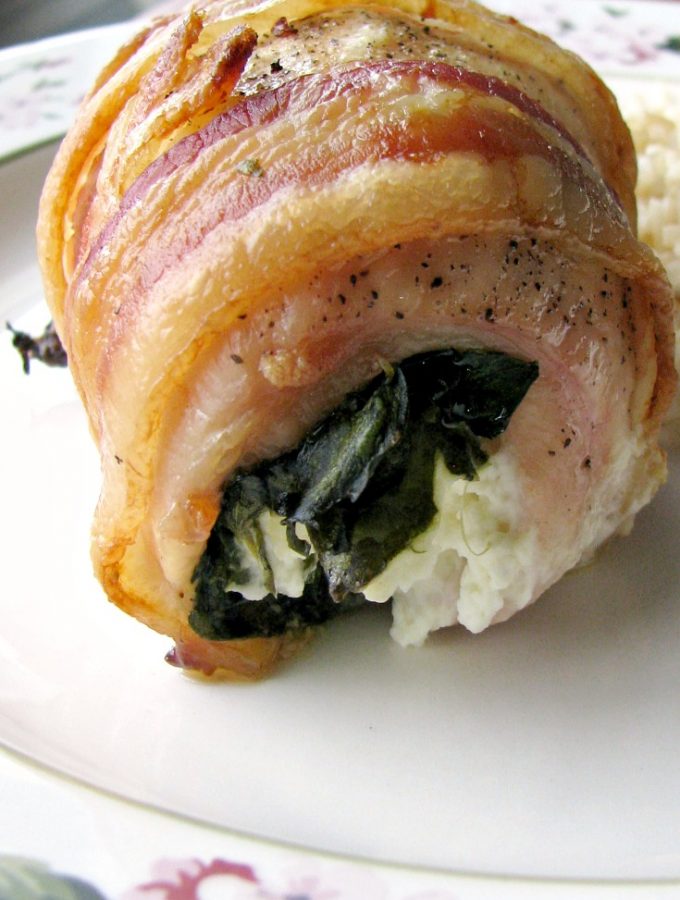 Close up photo of Bacon Wrapped Spinach Cream Cheese stuffed chicken breast.