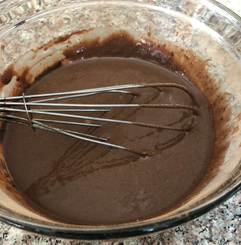 photo of a bowl of cocoa powder mixed with condensed milk