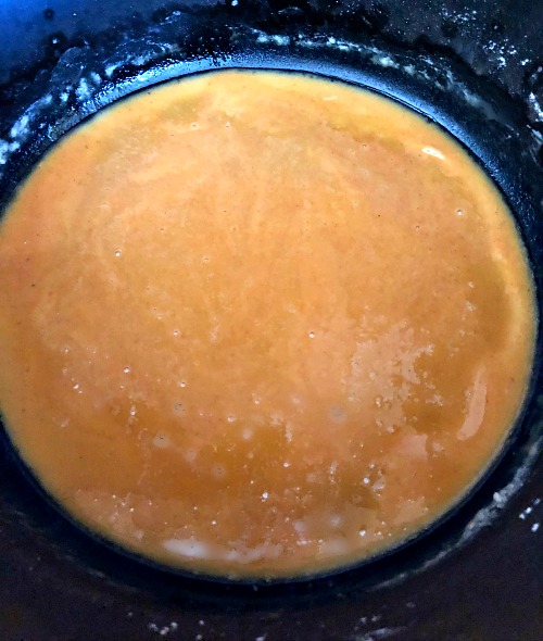 photo of a cooked butter and flour roux in a cast iron pot 