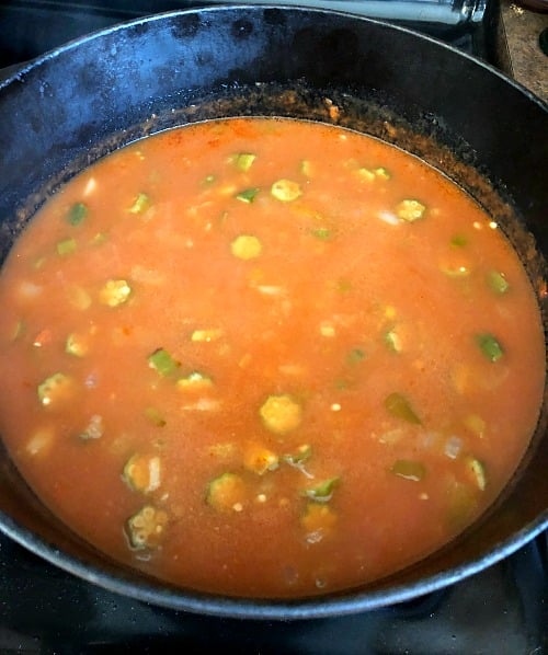 photo of seafood gumbo simmering on the stove 