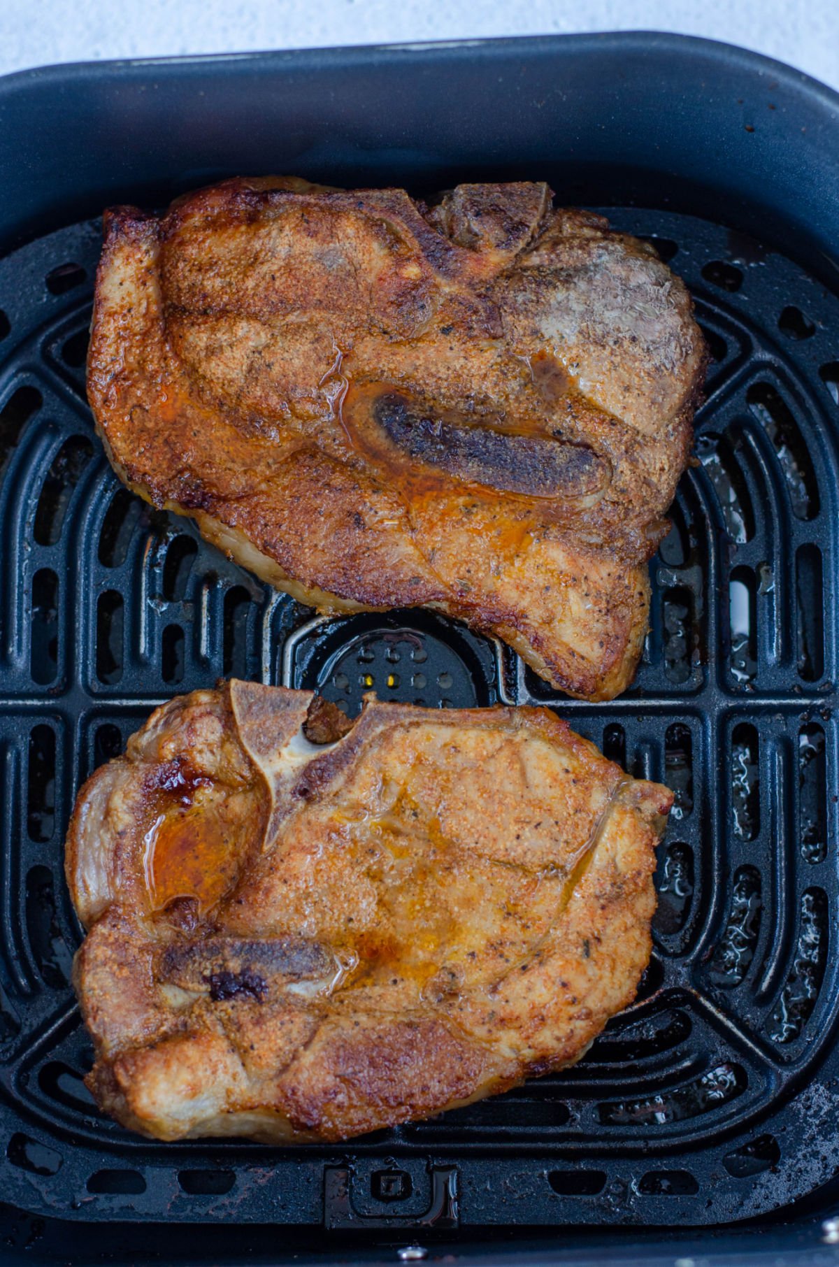 cooked pork chops in an air fryer